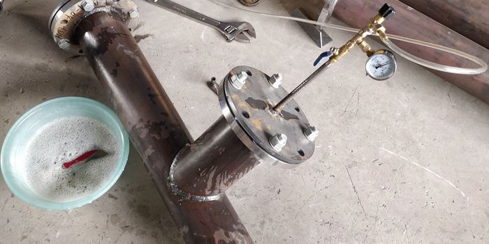 1576459391117029.jpg 附图五:管段成品打压检查焊缝漏点.jpg